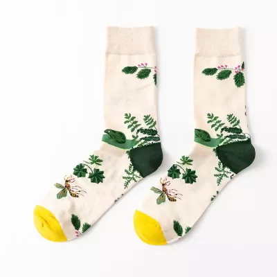 Desert Bloom: Whimsical Cactus Cartoon Socks - White green leaves design